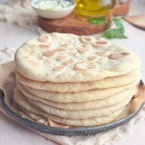 Greek Pita Flatbread stacked on plate