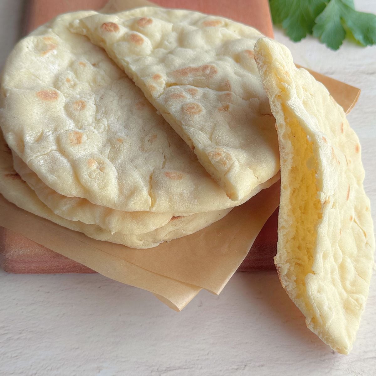 No yeast stovetop pita bread with one pita opened to show the soft inside for wraps or fillings.