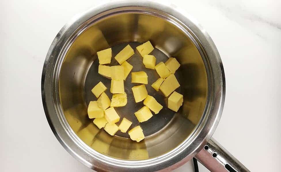 Start by heating the butter in a heavy-based pot on very low heat.