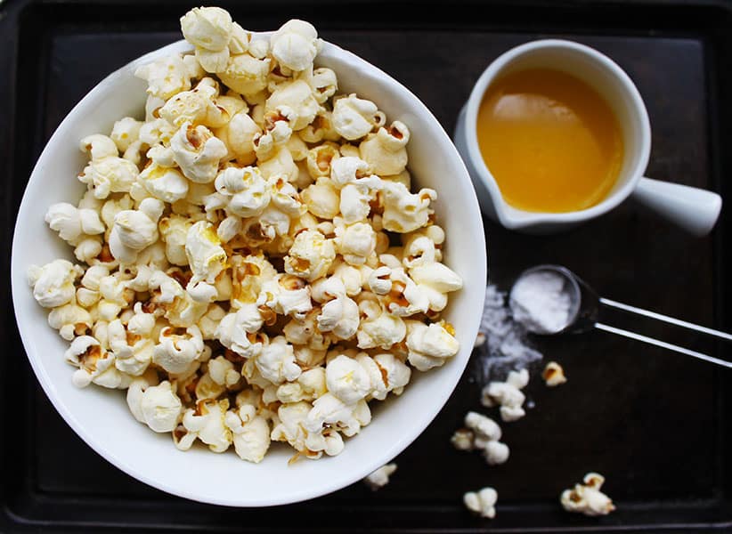 Are you a big fan of crispy popcorn? Then you are going to love my Movie Style Popcorn recipe. Buttery, super crisp and irresistibly delicious. Perfect to enjoy as a quick snack or tuck into a heaping bowl with a movie. Using just 3 ingredients, now you can make this all-time classic movie snack at home.  