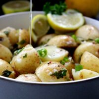A twist on the classic recipe, this No Mayo Potato Salad is light, tangy, and packed with incredible flavor. It's a great side dish to any meal and ideal to make in advance. The longer the potatoes absorb the dressing, the more flavorsome it becomes.