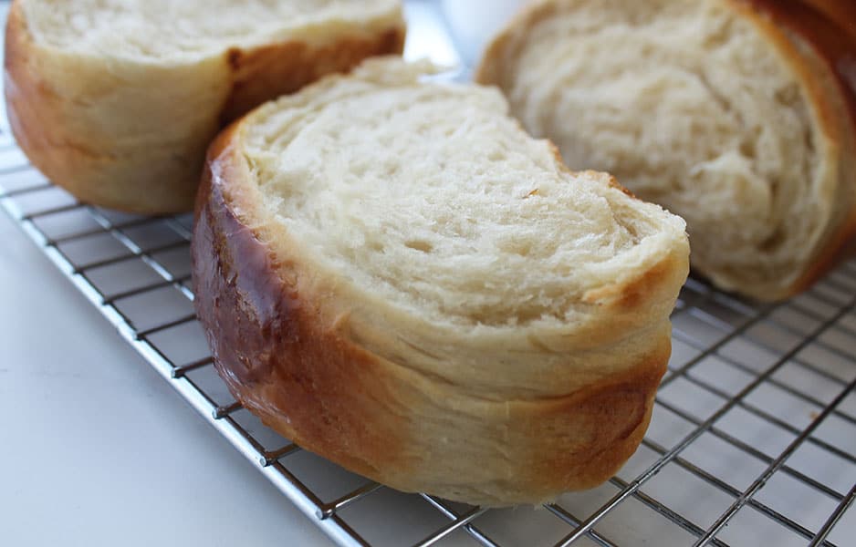 Fill your home with the delicious aroma of my bakery-style Condensed Milk Bread. Super soft, fluffy, and light makes an impressive bake or enjoyed as an everyday bread recipe.