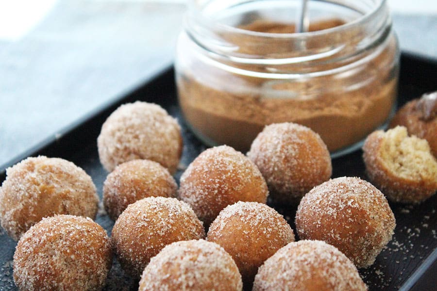 Treat yourself to a batch of No Yeast Cinnamon Sugar Donuts today. Tossed in cinnamon sugar and eaten still warm. This is the ultimate any day, anytime snack. These donuts are super easy to make with no yeast added, means no rising time or kneading required. You don't even need a donut cutter and that's another bonus with this recipe! Simply mix, roll, and fry.