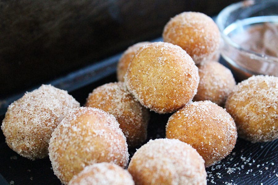 Although these are best eaten warm straight after frying, you can microwave leftovers for a few seconds. Reheating softens the donuts bringing them back to their glorious deliciousness. 