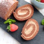 Chocolate Swiss Roll (Chocolate Cake Roll) sliced to show the spiral filling