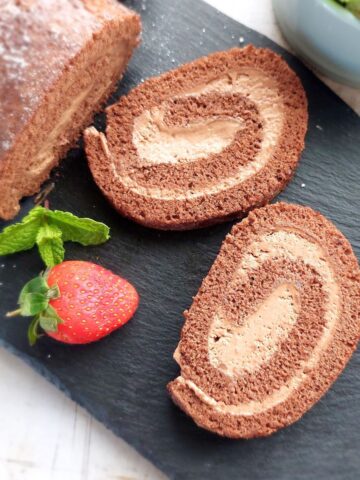 Chocolate Swiss Roll (Chocolate Cake Roll) sliced to show the spiral filling