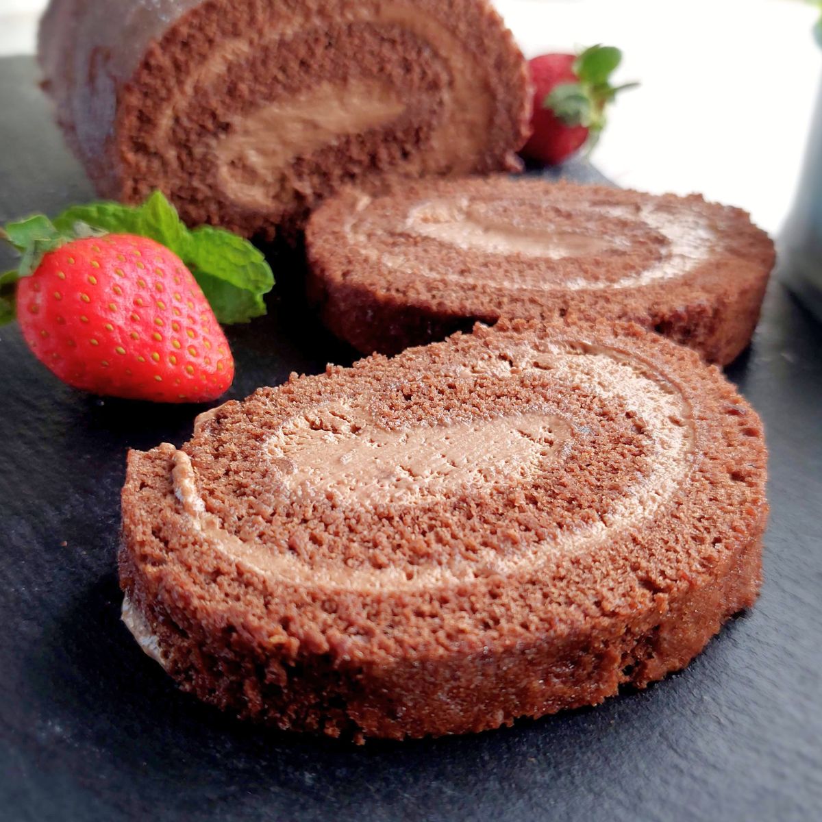 Chocolate Swiss Roll slice showing soft chocolate sponge and mousse spiral filling