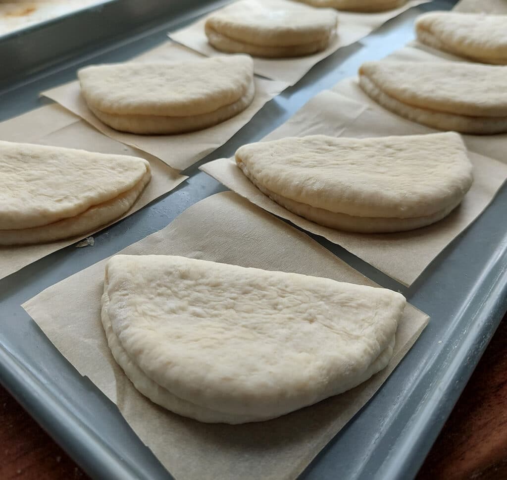 Place the shaped buns on cut out pieces of parchment paper and allow to rise again for 20 minutes. This rise will ensure the buns have a soft texture once steam