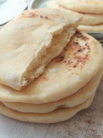 Soft pita bread cooked on the stovetop with a fluffy interior and pocket