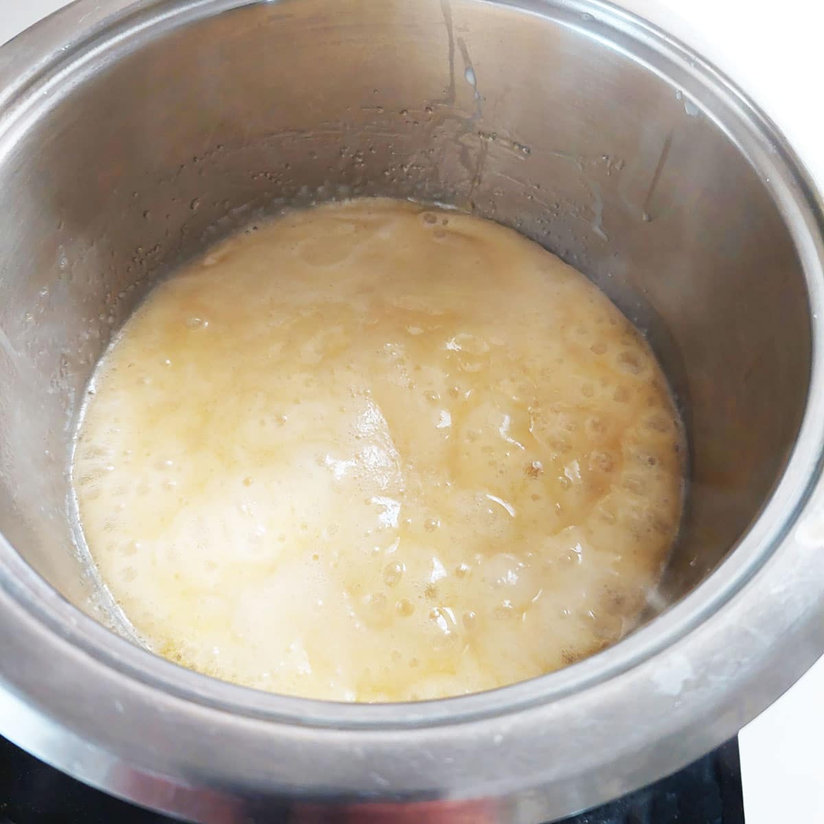 In a medium pot, combine the butter, brown sugar, heavy cream and salt. Boil over medium heat for 1 minute. Remove from heat and let sit for 5 minutes.