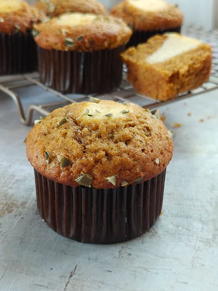 Filled and topped with a piping of cheesecake batter offers tangy balance to the sweet pumpkin muffins
