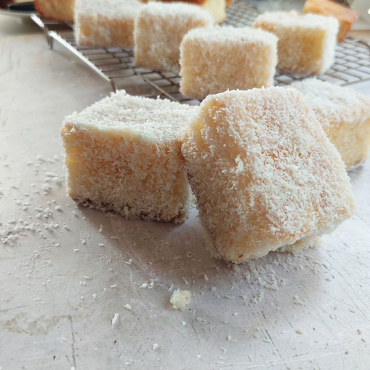 White Chocolate Lamingtons are fluffy sponge cakes, covered in white chocolate and coconut. 