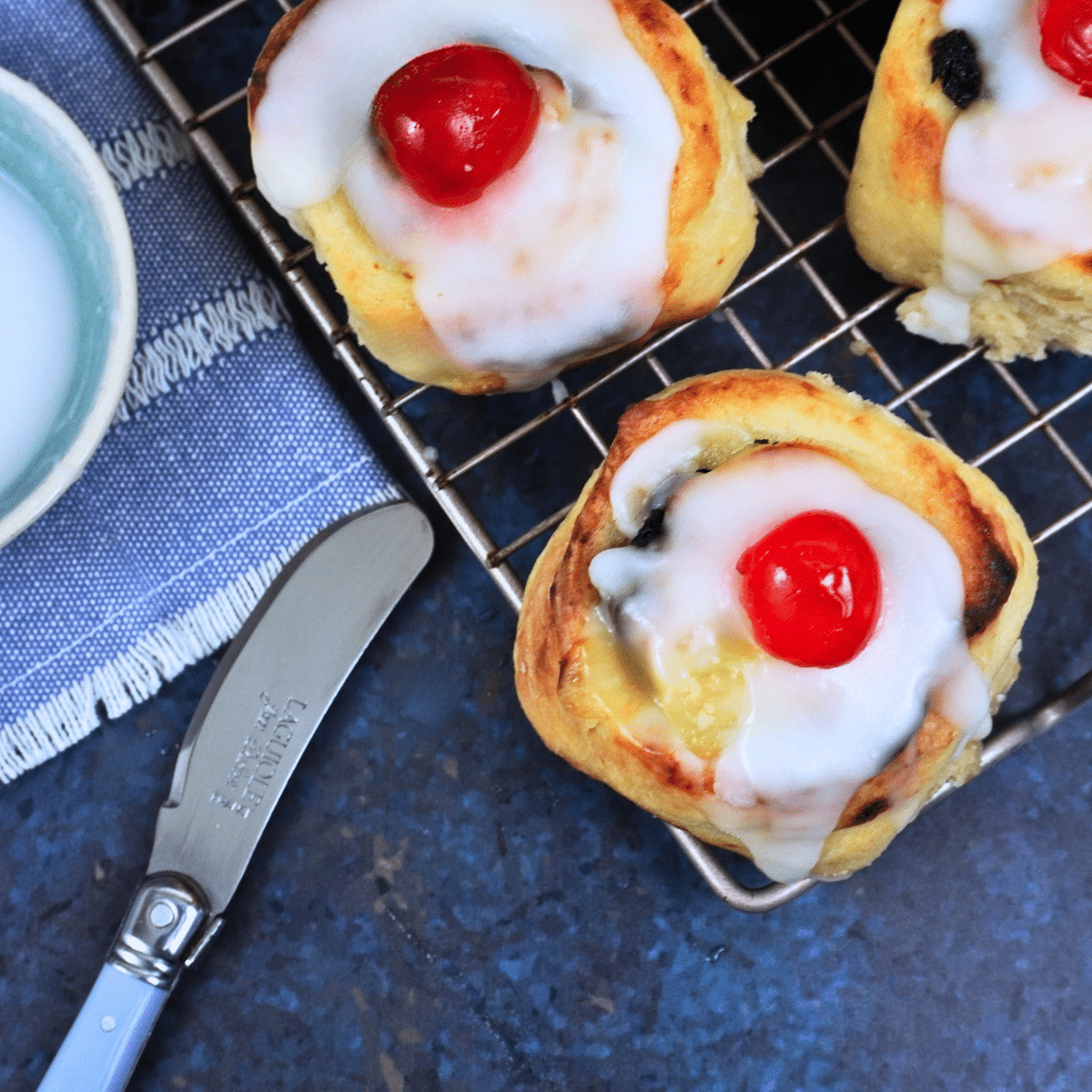No yeast Lemon Curd Rolls (Belgian buns) on a cooling rack.