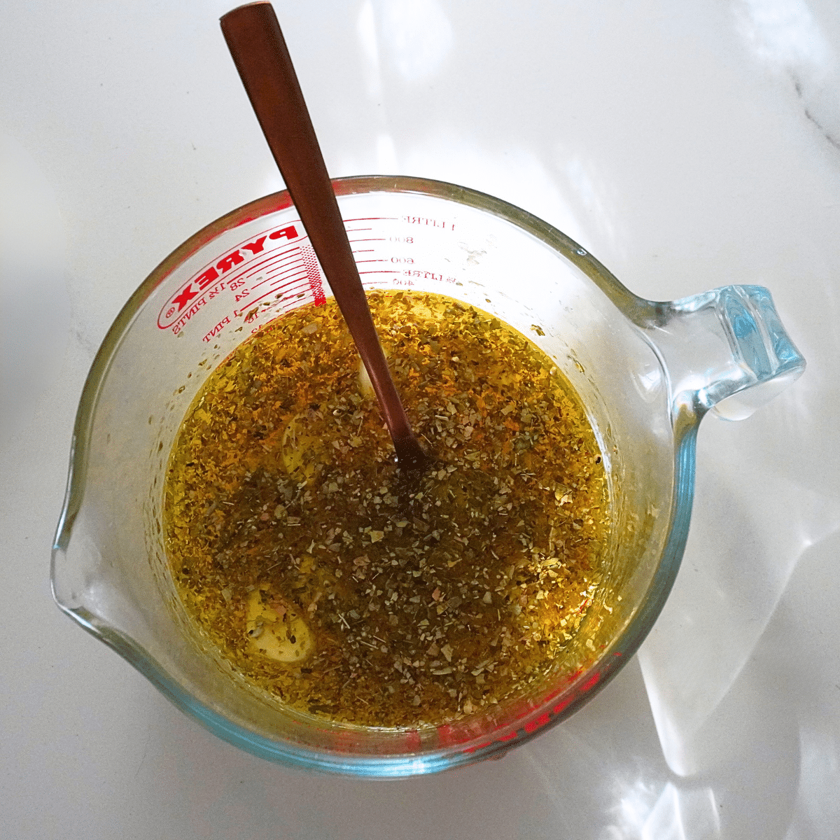 mixture of olive oil, broth, herbs