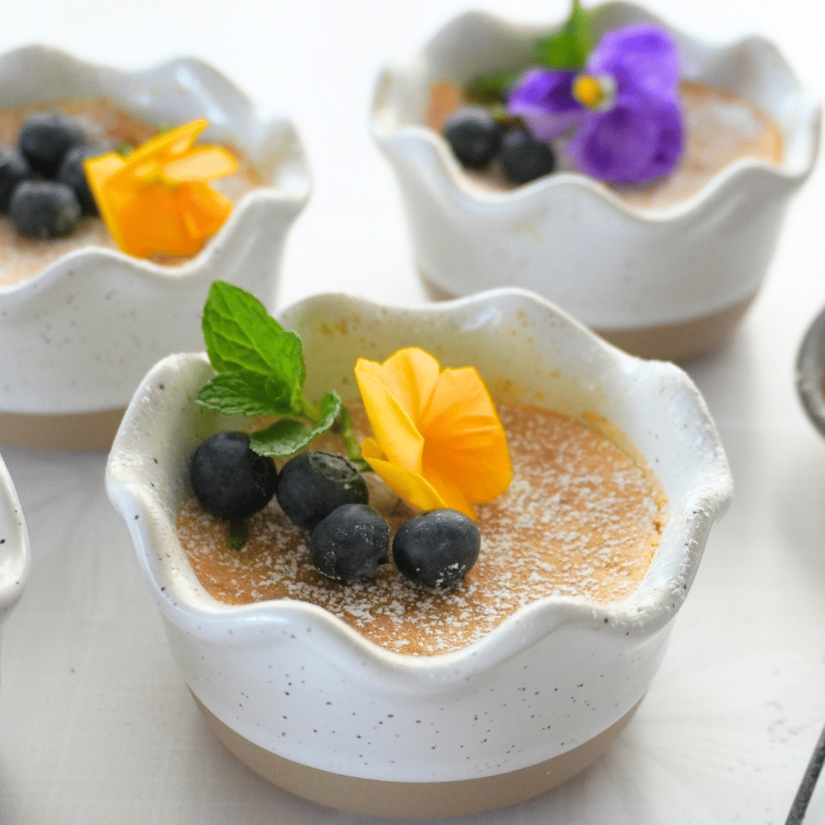 Lemon pudding cake garnished with flowers