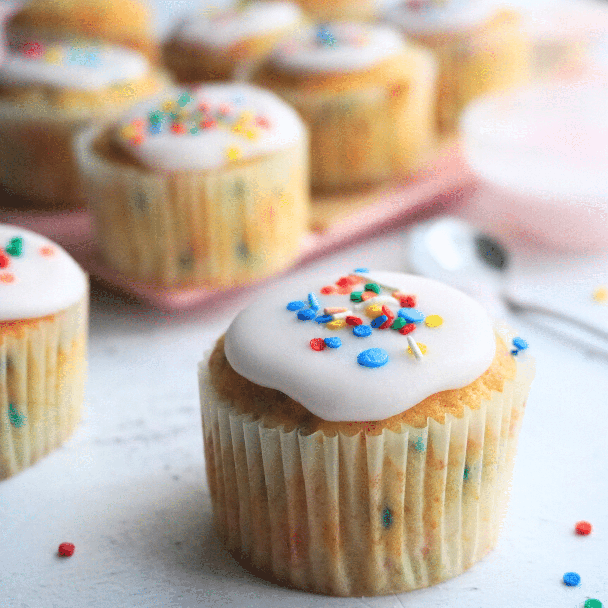 Funfetti cupcakes glazed with sprinkles