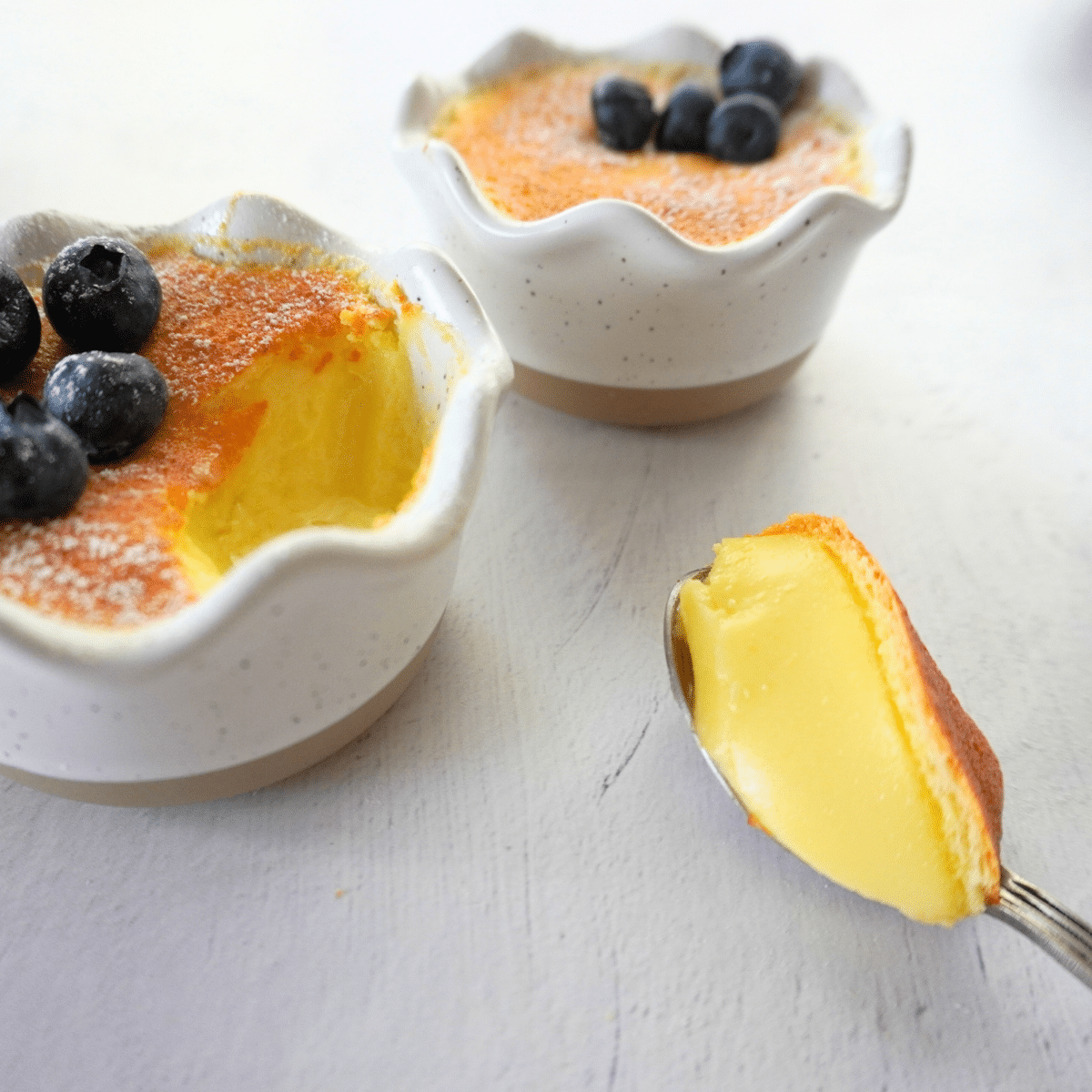 Lemon pudding cake on a spoon
