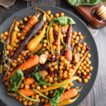 Honey Roasted Carrots & Chickpeas (garbanzo beans) is a delicious side dish that can double as a light vegetarian main course. It’s a great mix of sweet, savory, and crunchy, and goes perfectly with roasted meats, grilled dishes, or grains like quinoa and couscous.