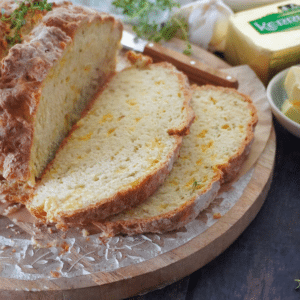 Slices of Cheese and garlic Irish soda bread on board
