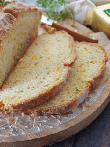 Slices of Cheese and garlic Irish soda bread on board