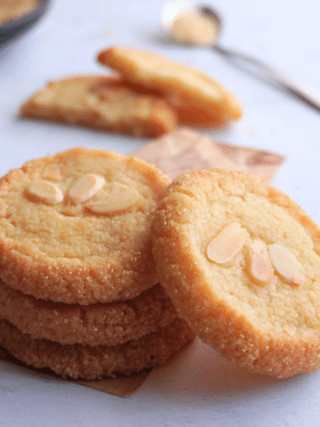 These Marzipan Butter Cookies are rich with crisp edges and a chewy center. Packed with almond flavor and finished with sugar-coated edges, they’re elegant and easy to make with either homemade or store-bought marzipan.