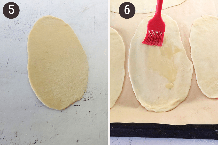 Use a rolling pin to roll each piece into a thin 8-inch (20 cm) oval, ⅛-inch (3 mm) thick. Preheat the oven to 425°F (210°C) about 5–10 minutes before you're done rolling the dough.
Place the rolled flatbreads on a large baking sheet lined with parchment paper (baking paper) and brush each with olive oil.
