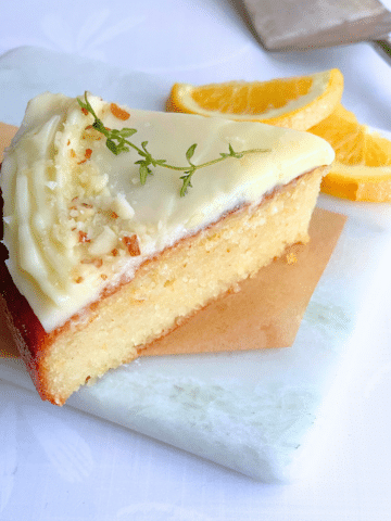 slice of almond flour cake on a marble plate