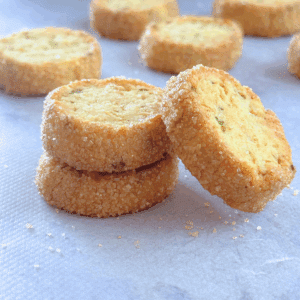 oat zucchini butter cookies stacked, with one leaning to the side