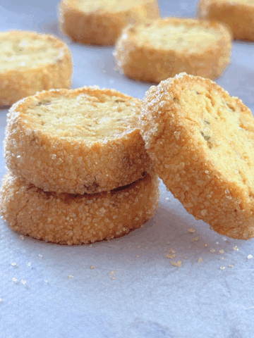 oat zucchini butter cookies stacked, with one leaning to the side