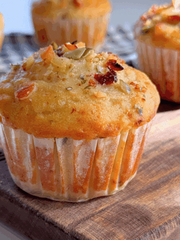 Soft and golden trail mix muffin topped with chopped nuts and seeds, perfect for easy egg-free breakfasts or snacks