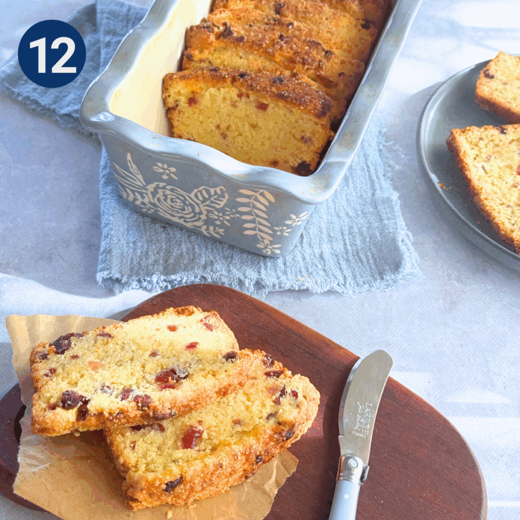 Sliced cranberry scone loaf served on board