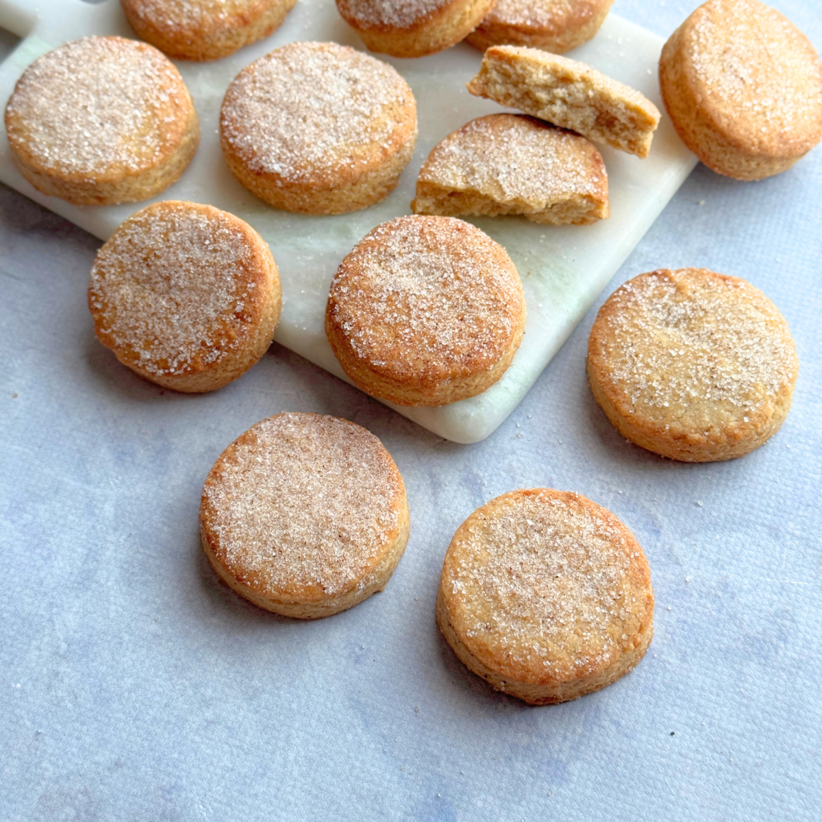 Apple fritter butter cookies top view on marble board with broken cookie to show texture