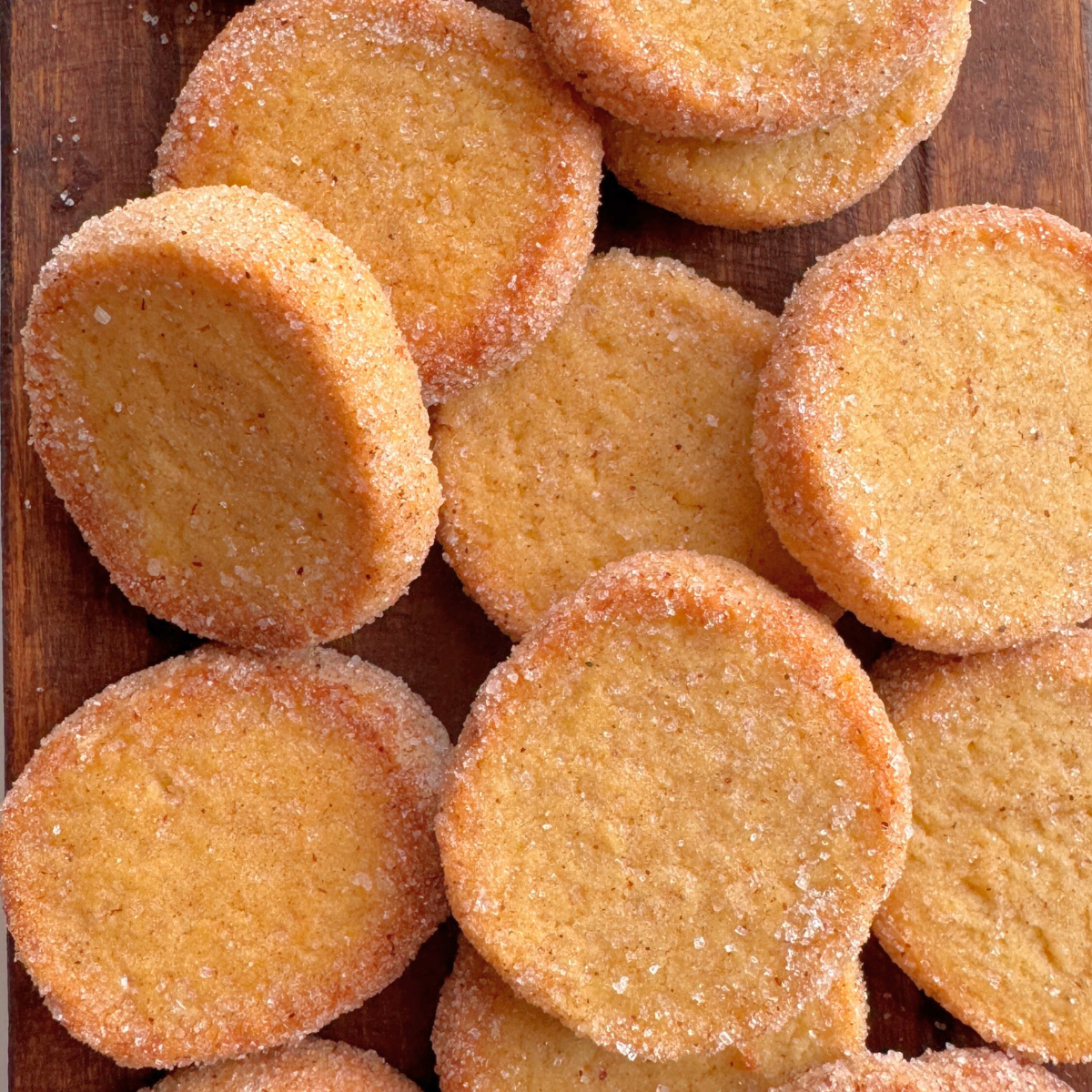 Close-up of pumpkin butter cookies showing crisp sugar edges and golden buttery centers