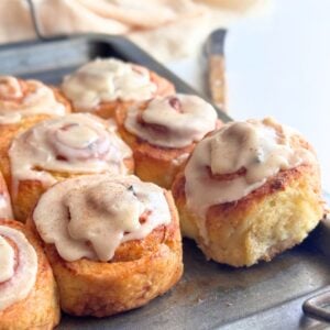 Close up of soft no yeast banana cinnamon rolls with thick brown butter glaze on top