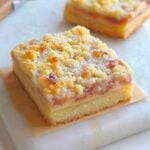 Strawberry yogurt crumble bars with strawberry jam and a buttery crumble topping
