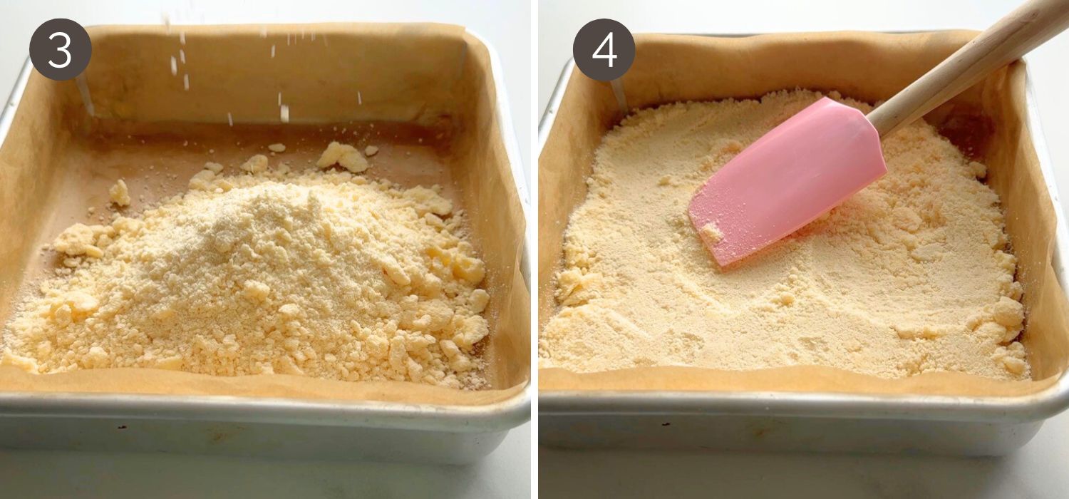 Crumbly dough mixture being added to a parchment-lined square pan and pressed to form the crust for strawberry yogurt crumble bars.