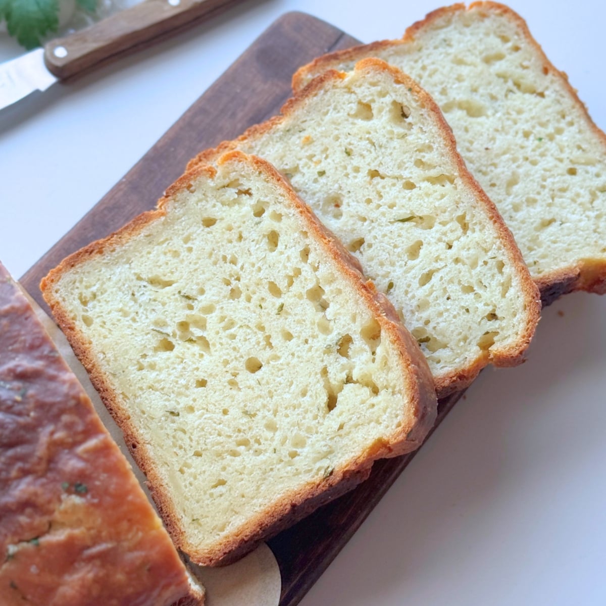Greek Yogurt Garlic Butter Bread sliced on a board