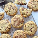 Soft chocolate chip oat cookies on cooling rack